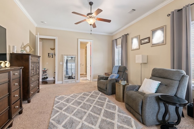 sitting room with light carpet, crown molding, and ceiling fan