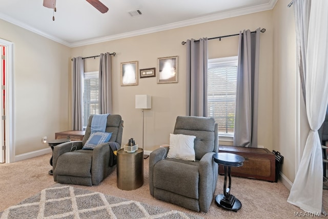 sitting room with light colored carpet, plenty of natural light, and ceiling fan