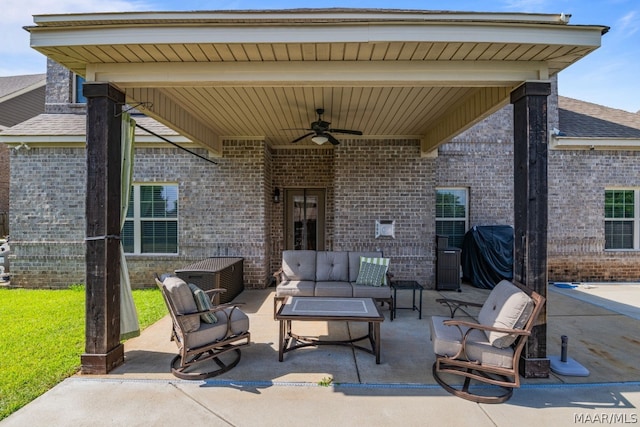 view of patio with area for grilling, ceiling fan, and outdoor lounge area