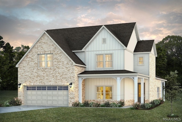 view of front of house with a garage and a yard