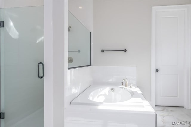 full bath with marble finish floor, a garden tub, and a stall shower