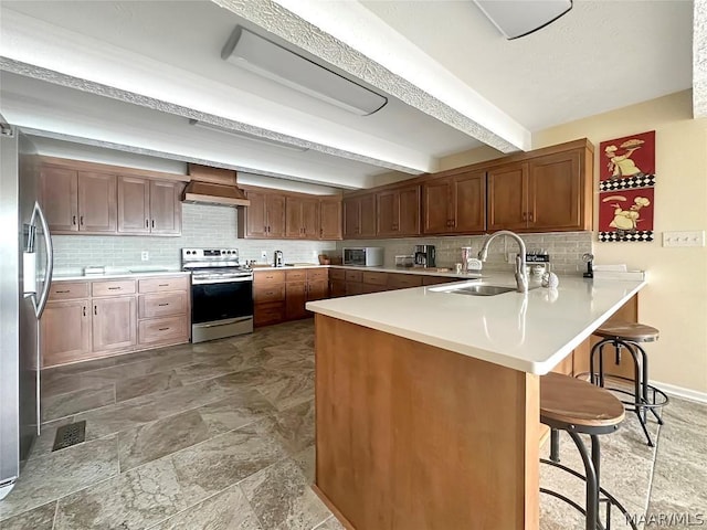 kitchen with a kitchen breakfast bar, custom range hood, appliances with stainless steel finishes, beamed ceiling, and kitchen peninsula