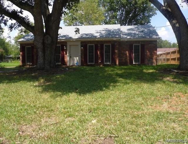 ranch-style house with a front lawn