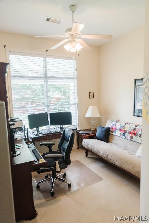 home office featuring ceiling fan and carpet floors