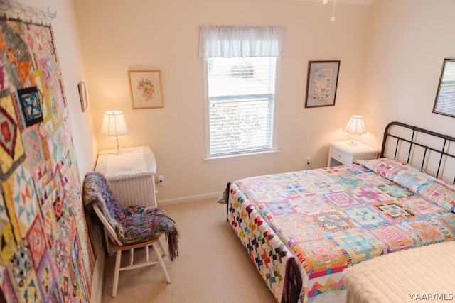 bedroom featuring light colored carpet