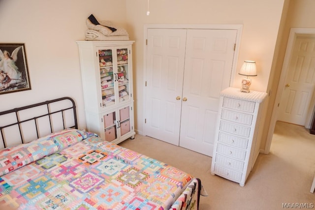 carpeted bedroom featuring a closet