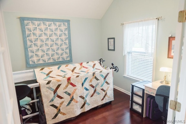 bedroom featuring dark hardwood / wood-style flooring and vaulted ceiling