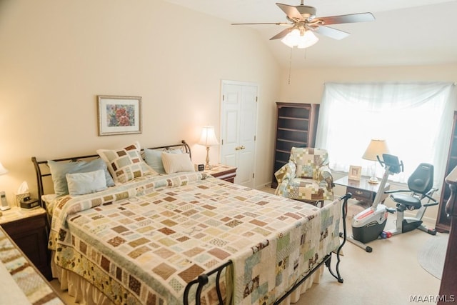 carpeted bedroom featuring ceiling fan and lofted ceiling