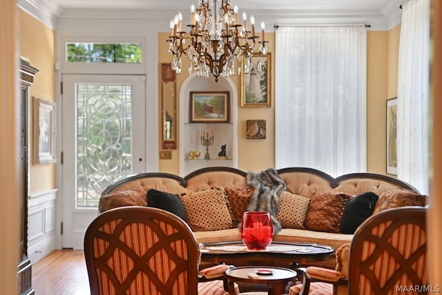 interior space with plenty of natural light, light hardwood / wood-style floors, and ornamental molding