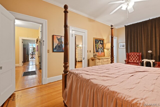 bedroom featuring ceiling fan, light hardwood / wood-style flooring, and crown molding