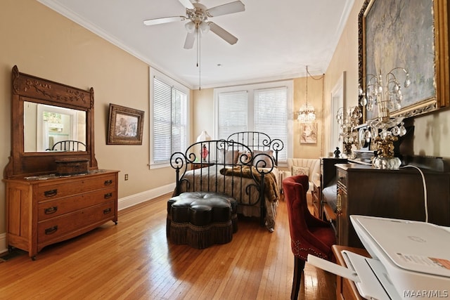 bedroom with ceiling fan with notable chandelier, light hardwood / wood-style floors, and ornamental molding