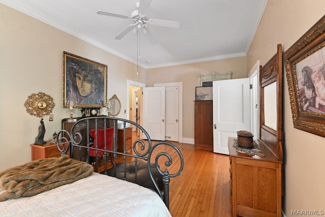 bedroom with ceiling fan, light hardwood / wood-style floors, and ornamental molding