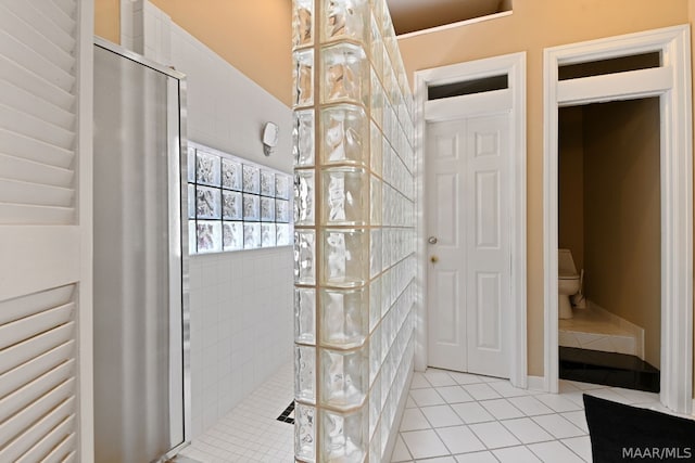 bathroom with tile patterned floors and toilet