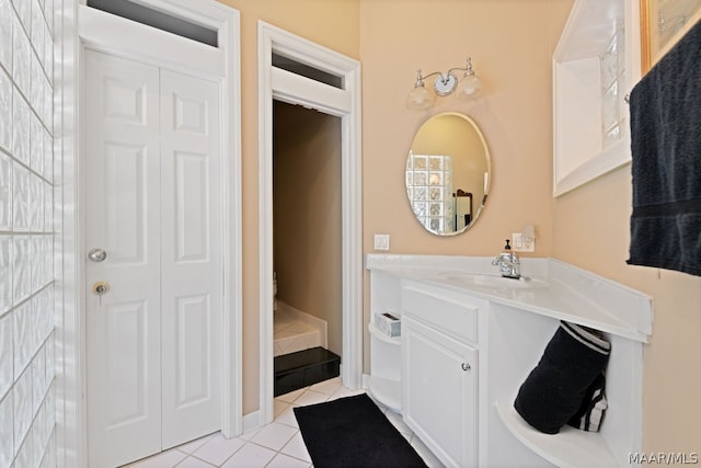 bathroom with tile patterned floors, vanity, and toilet