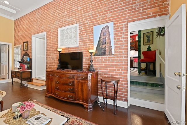 living room featuring brick wall