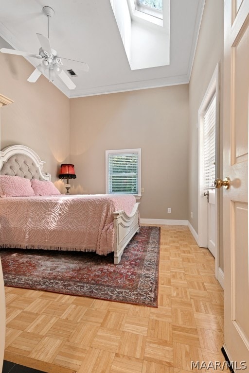 bedroom featuring light parquet flooring, a skylight, ceiling fan, and crown molding