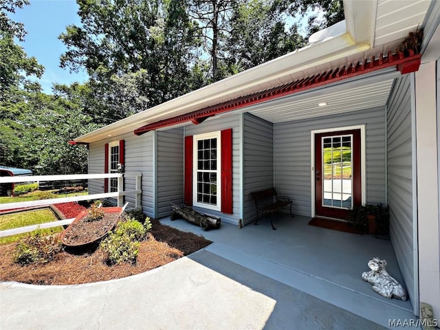 doorway to property featuring a porch