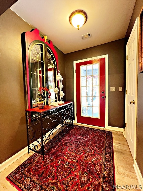 entryway with light hardwood / wood-style floors