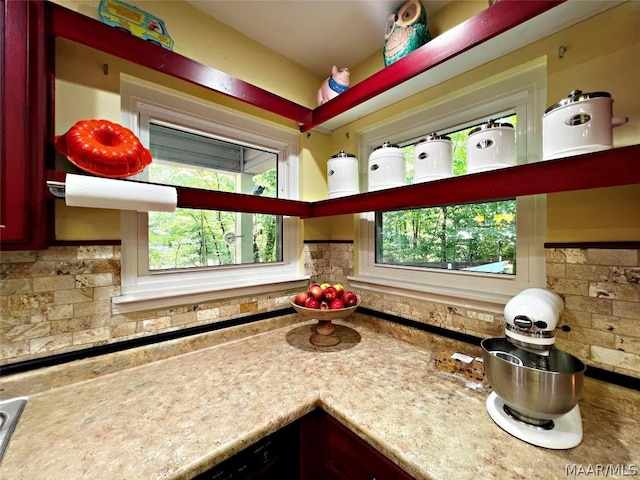 kitchen with light countertops and decorative backsplash