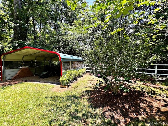 view of yard with a carport