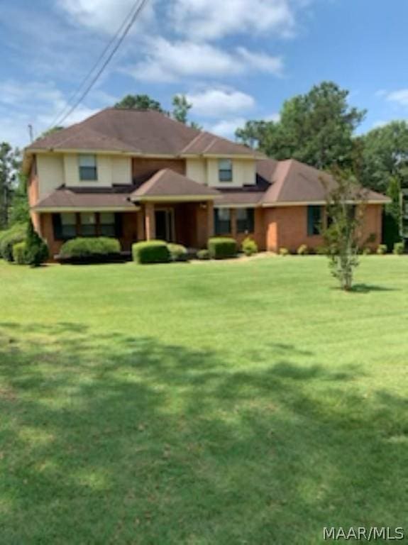 prairie-style home featuring a front lawn