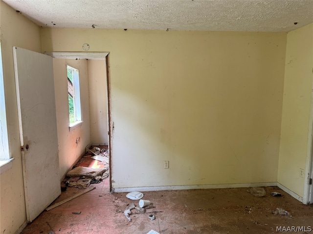 empty room with a textured ceiling