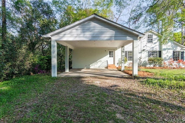 back of property with a carport