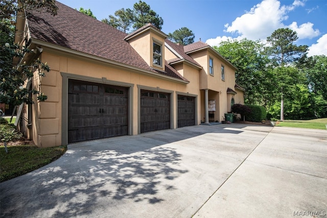 view of side of home with a garage