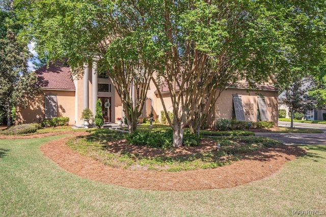 view of property exterior featuring a yard