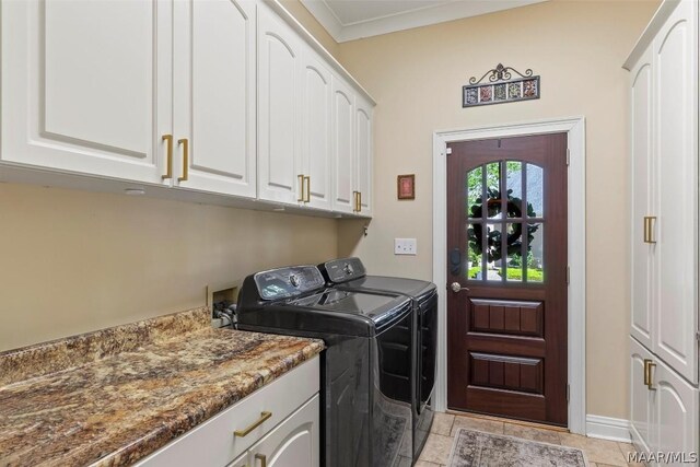 washroom featuring cabinets, crown molding, washer and clothes dryer, washer hookup, and light tile floors