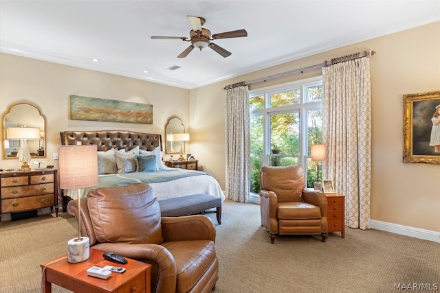 carpeted bedroom featuring ornamental molding and ceiling fan