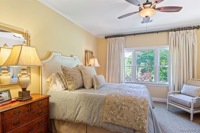 bedroom with carpet, ceiling fan, and crown molding