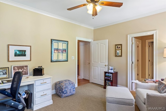 office area with ceiling fan and crown molding