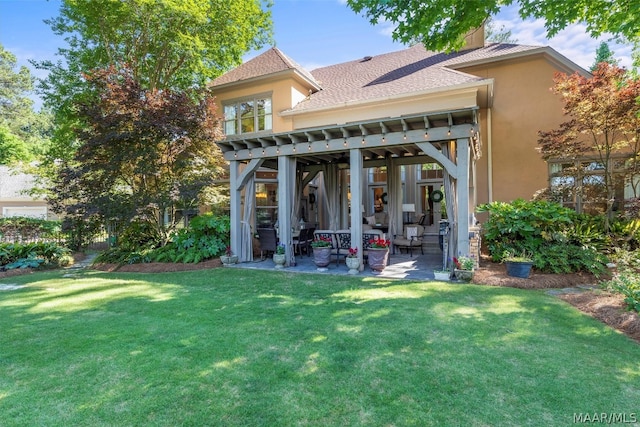 back of property featuring a pergola, a lawn, and a patio