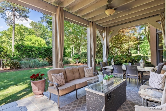 view of terrace with ceiling fan and outdoor lounge area