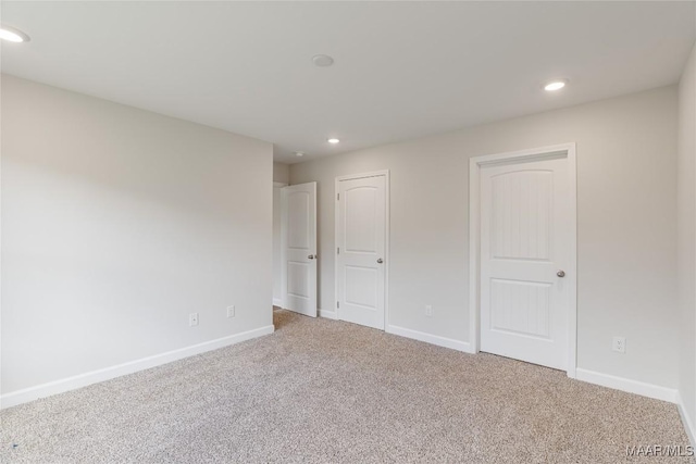 unfurnished bedroom with carpet flooring