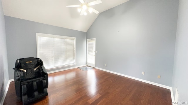 sitting room with high vaulted ceiling, ceiling fan, and dark wood-type flooring