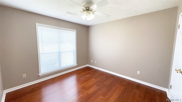 unfurnished room featuring ceiling fan, plenty of natural light, and hardwood / wood-style flooring