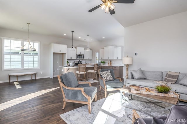 living room with a ceiling fan, baseboards, dark wood-style flooring, and recessed lighting