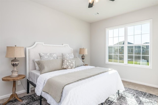 bedroom featuring ceiling fan, baseboards, and carpet flooring