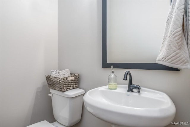 bathroom featuring a sink and toilet