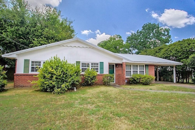 ranch-style home featuring a carport and a front yard