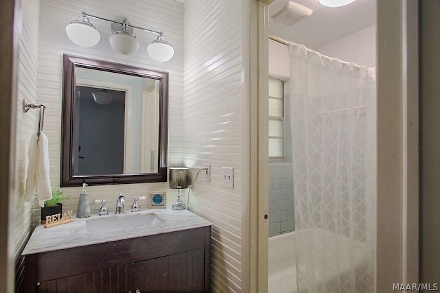 bathroom featuring shower / tub combo with curtain and vanity