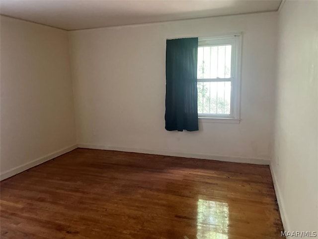 unfurnished room featuring dark hardwood / wood-style flooring