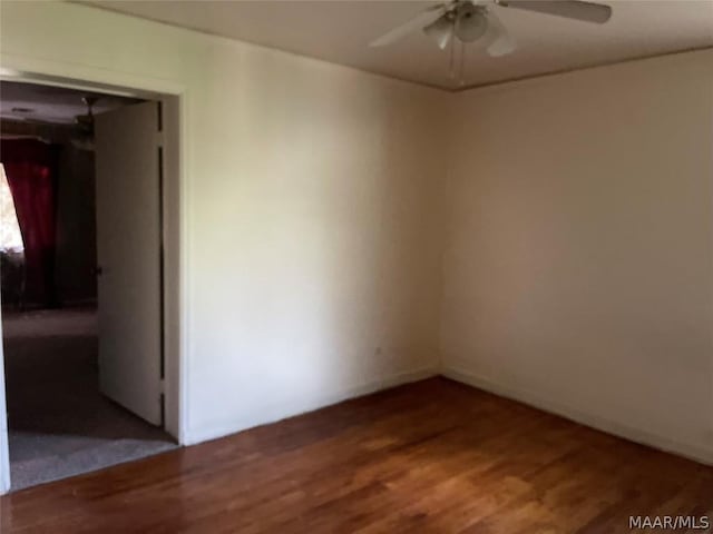 empty room with wood-type flooring and ceiling fan