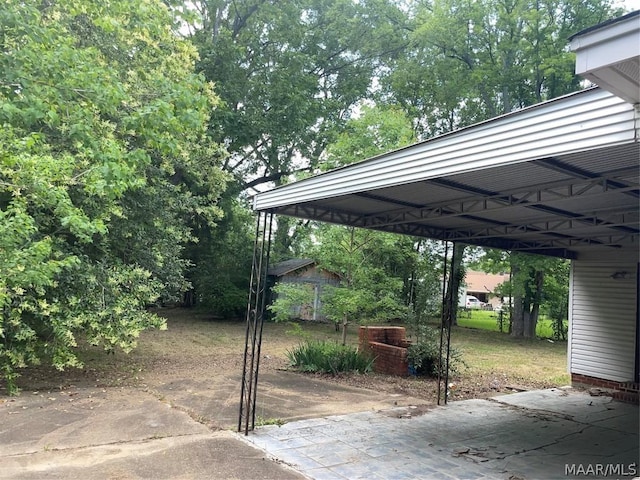 view of parking / parking lot featuring a carport