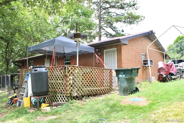 back of property featuring cooling unit