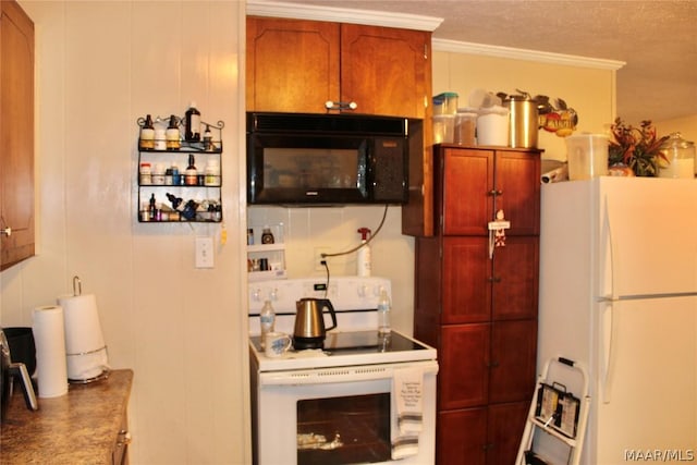 kitchen with a textured ceiling, white appliances, and ornamental molding