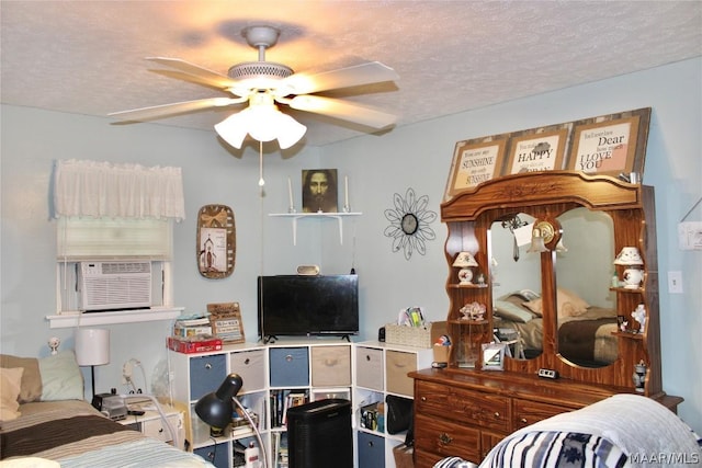 bedroom featuring a textured ceiling, ceiling fan, and cooling unit