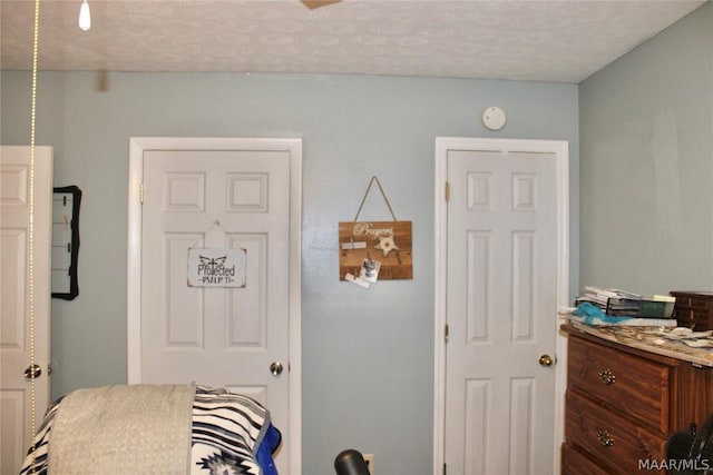 bedroom featuring a textured ceiling